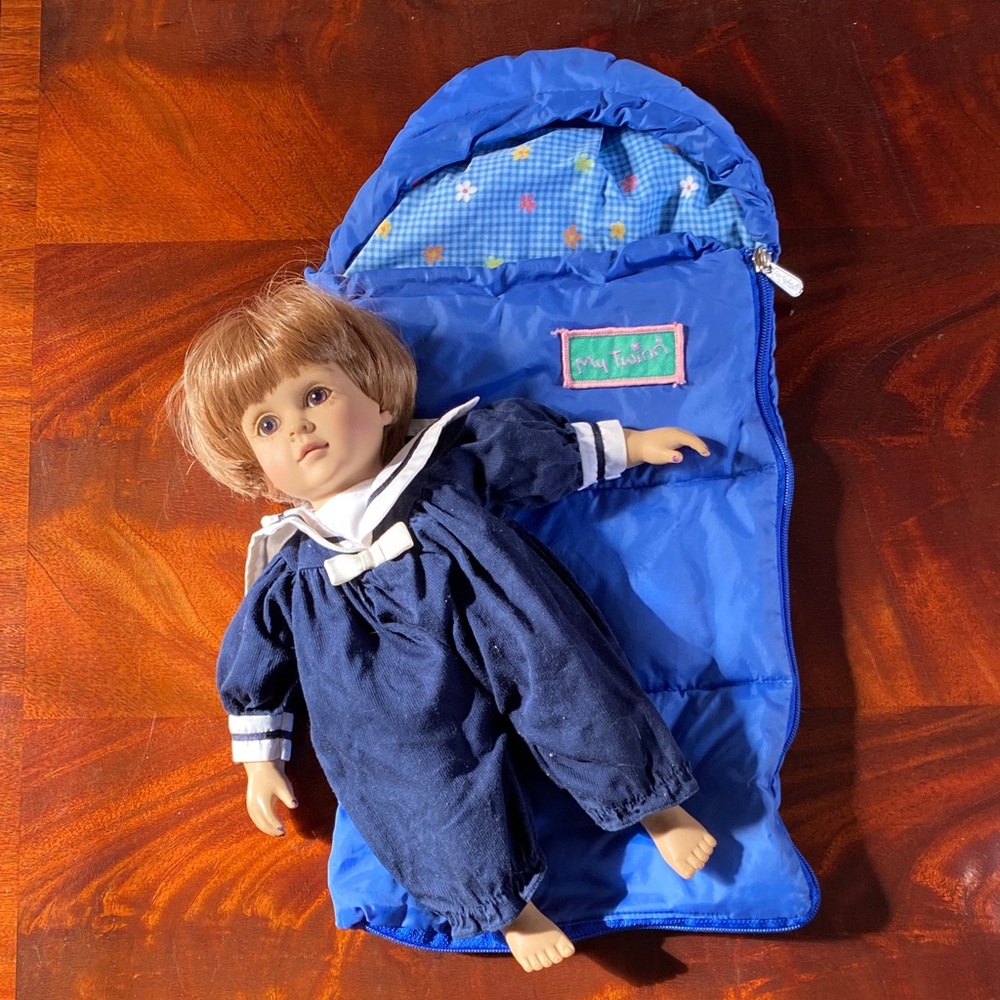 Cuddly Sisters Classic Brown-Haired Doll in sailer Outfit with sleeping bag